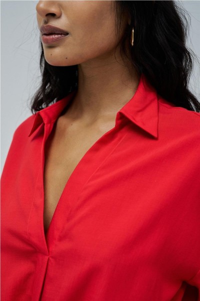 Camisa Salsa con lazo en el dobladillo