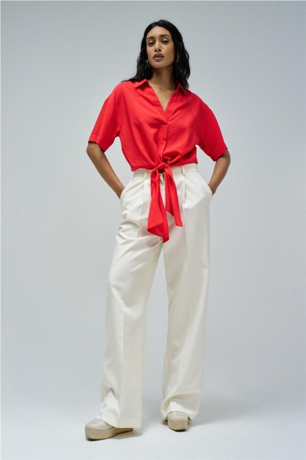 Camisa Salsa con lazo en el dobladillo